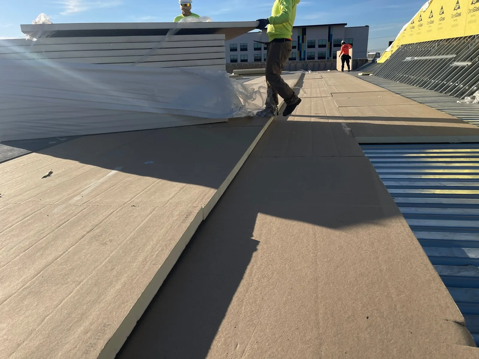 Polyiso going down over the steel deck