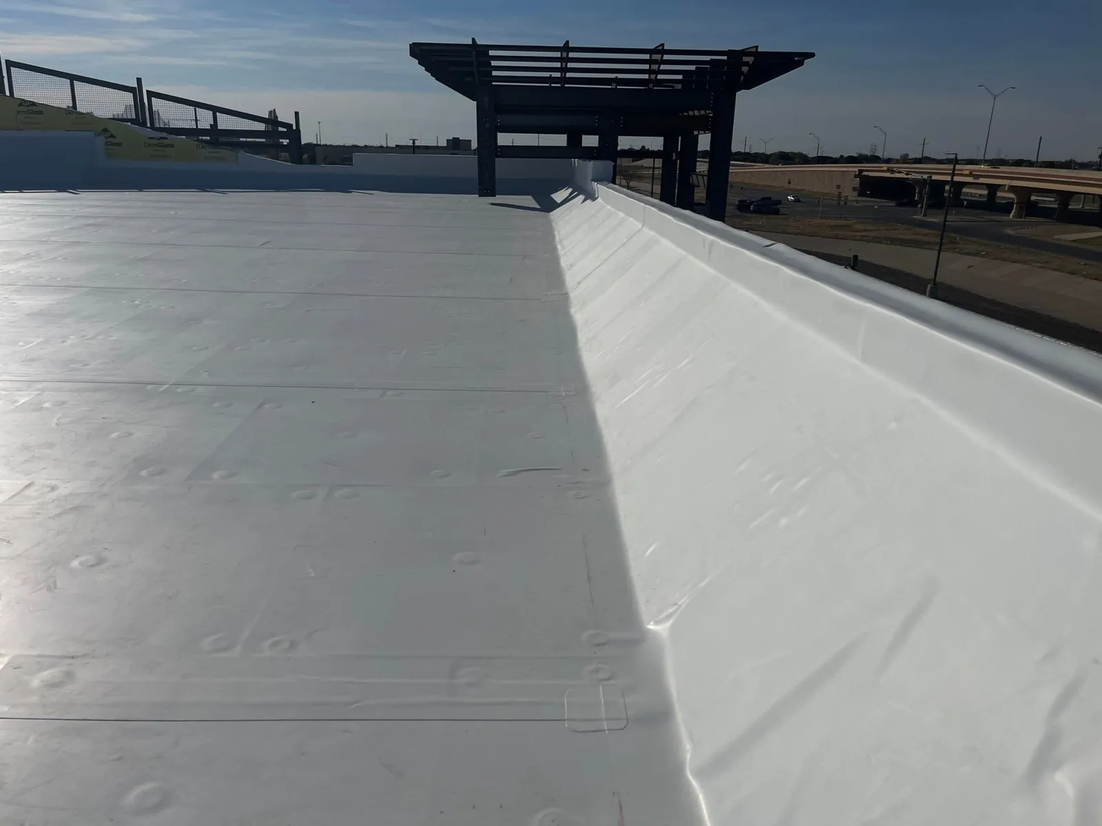 Curbs flashed and parapets wrapped