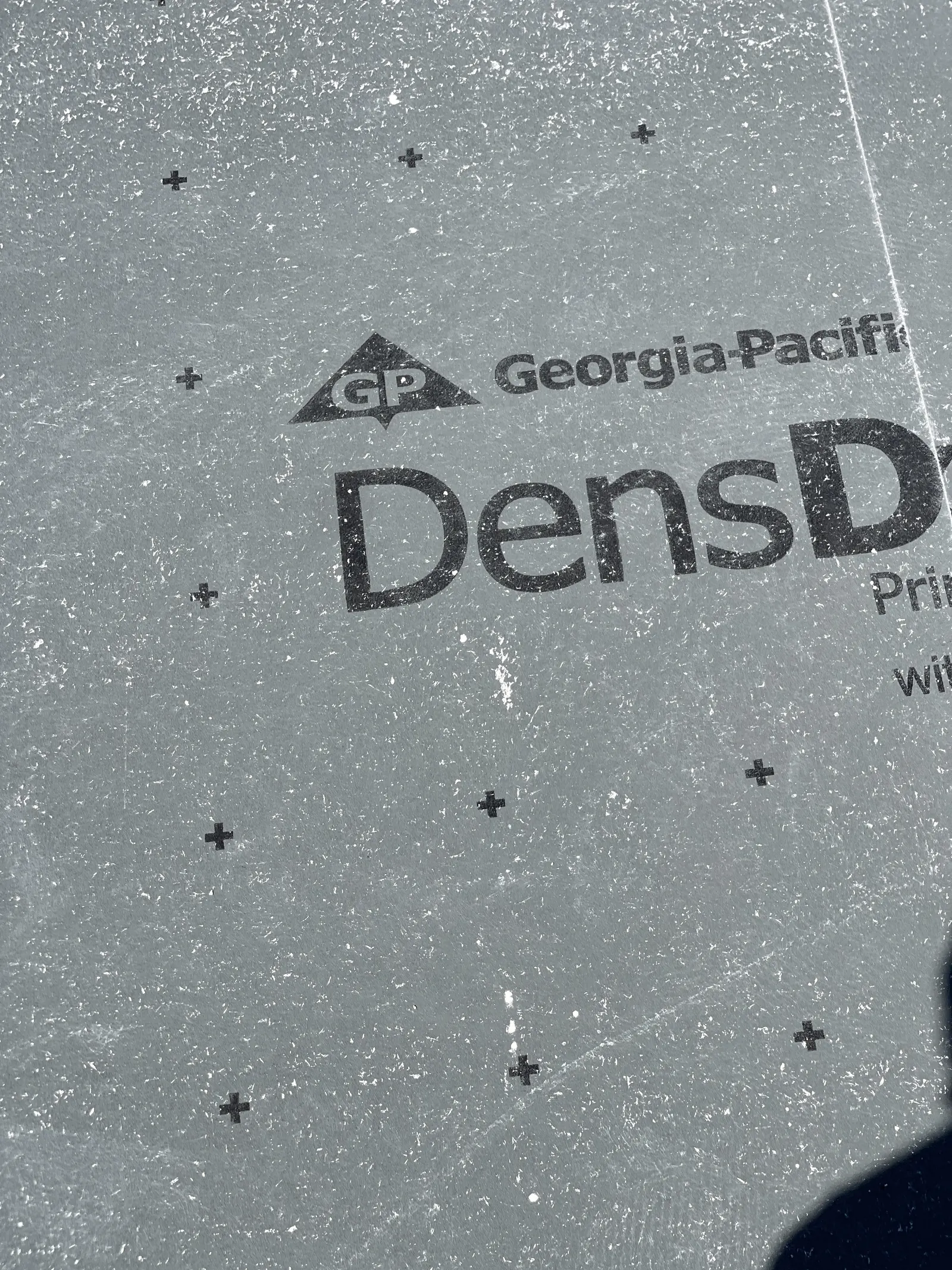 Georgia-Pacific DensDeck gypsum cover board installed with fastener pattern marks