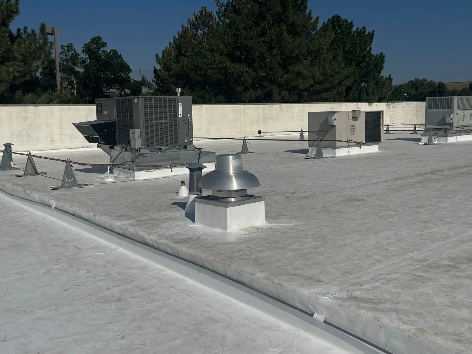 Finished roof with flashed RTU curbs