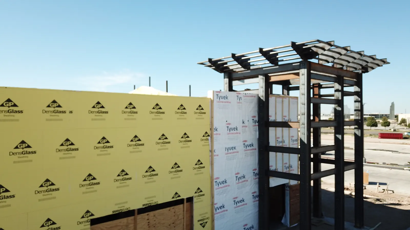Glass-mat exterior sheathing and commercial building wrap on a new commercial building