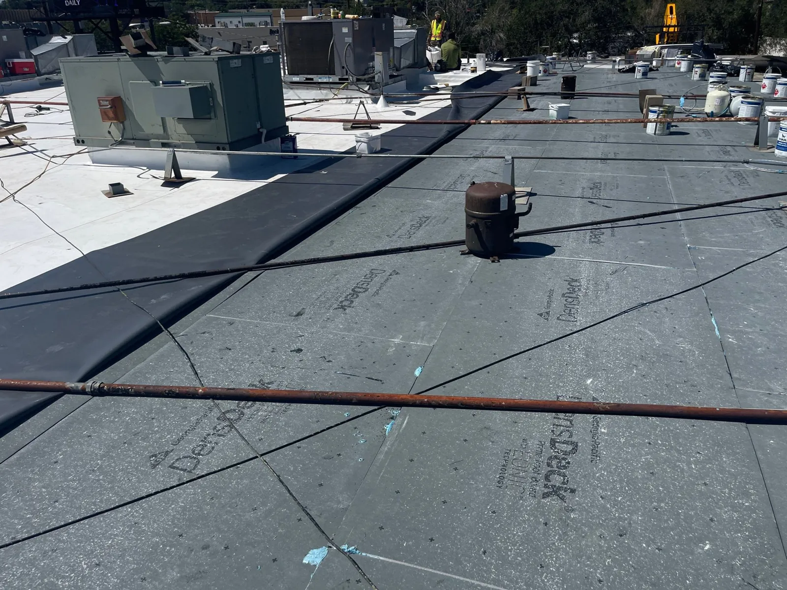 Existing roof, cover board and new TPO in one frame
