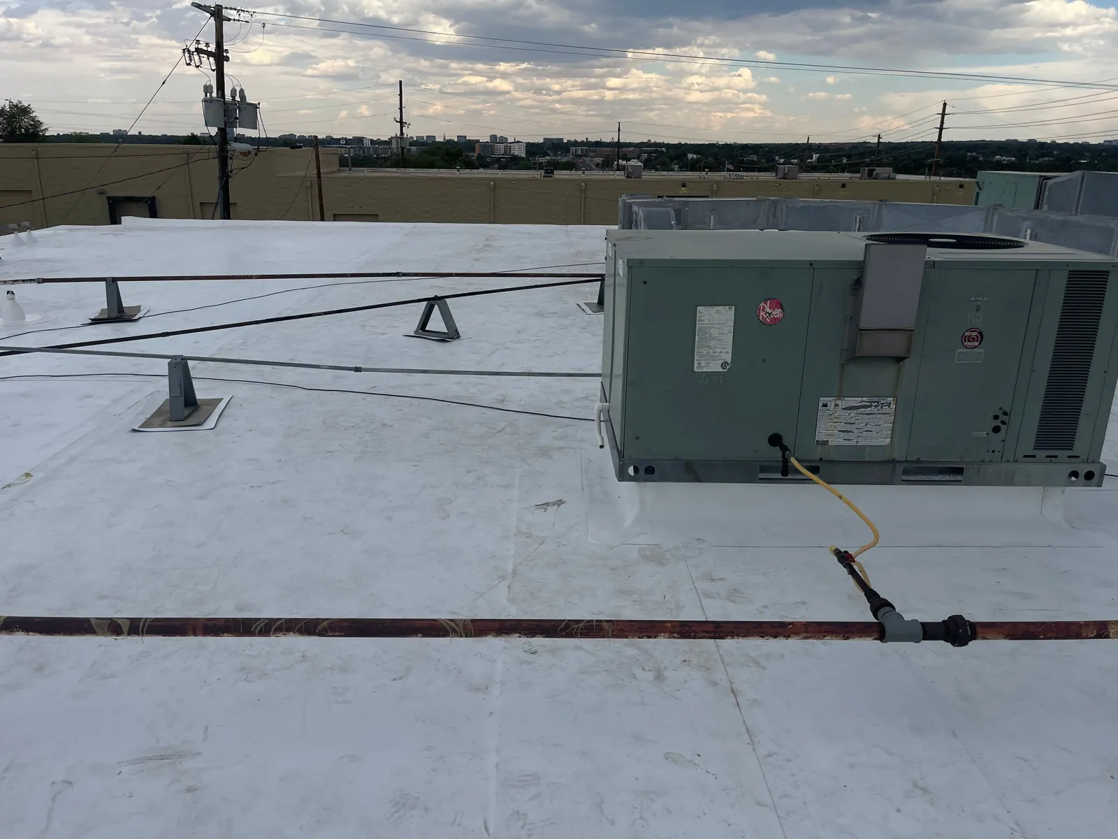 Completed roof with flashed penetrations